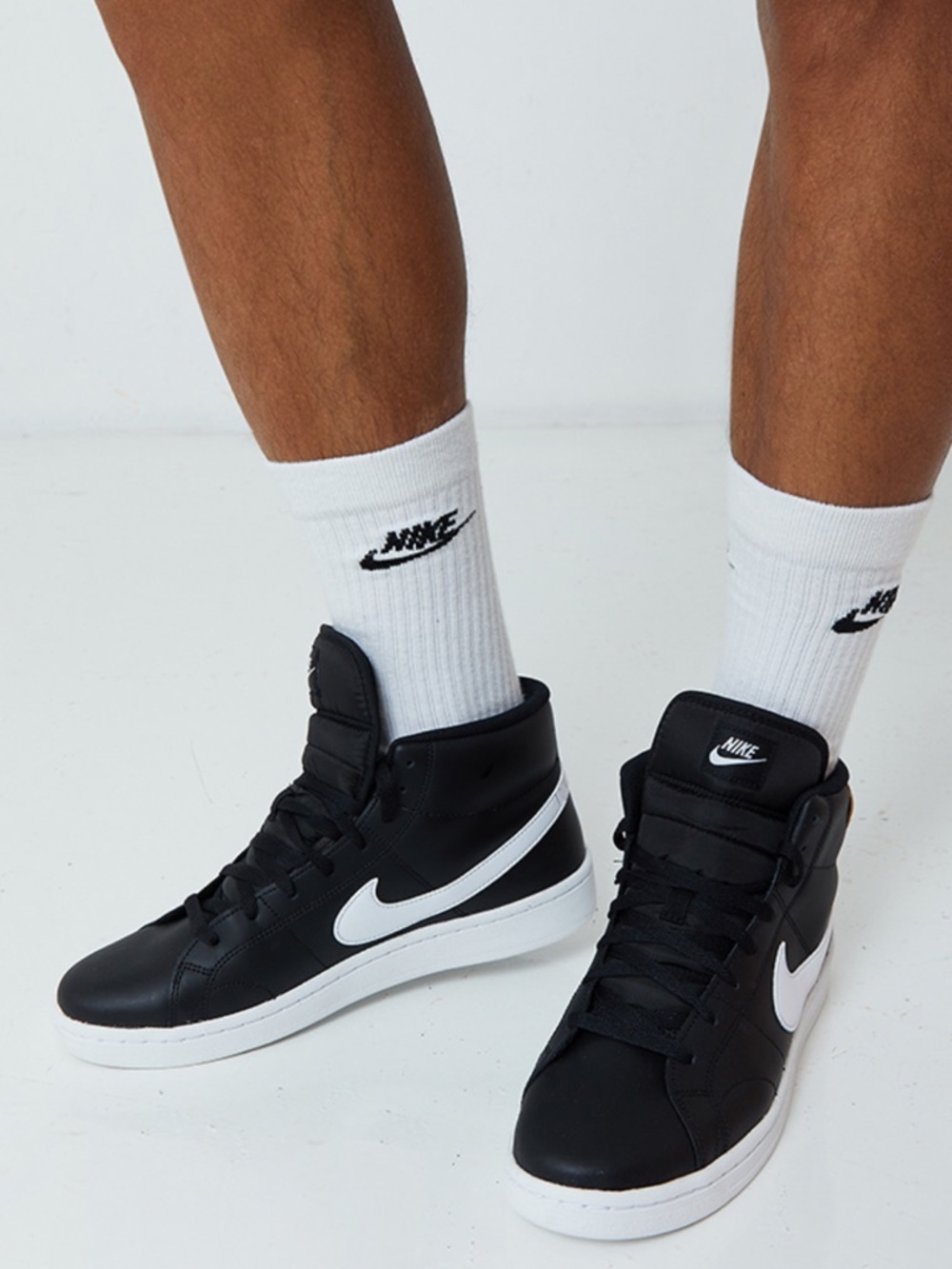 Nike Mid-Top Sneakers in Black and White